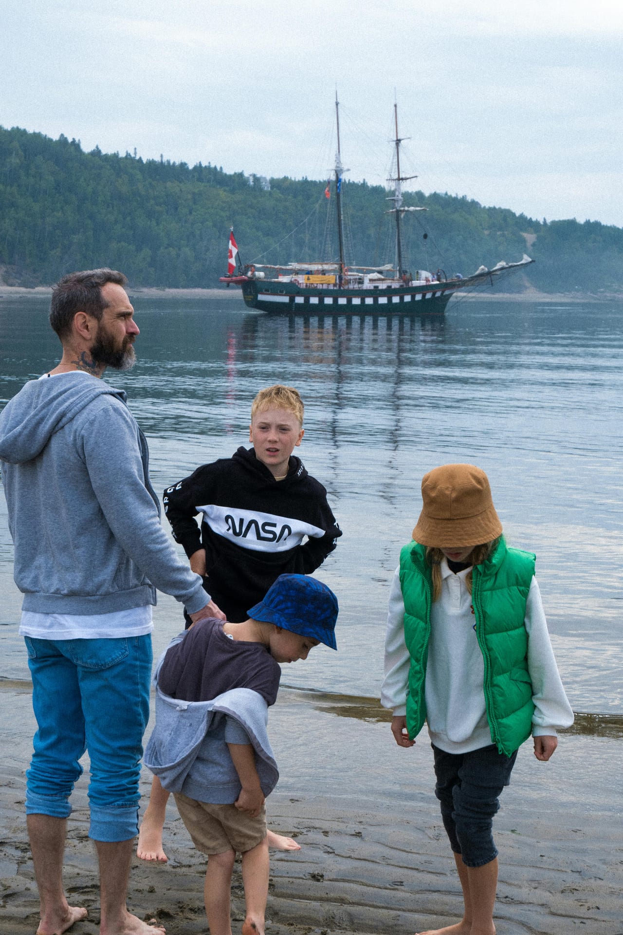 A 41 year old single father spends time by the water with his children